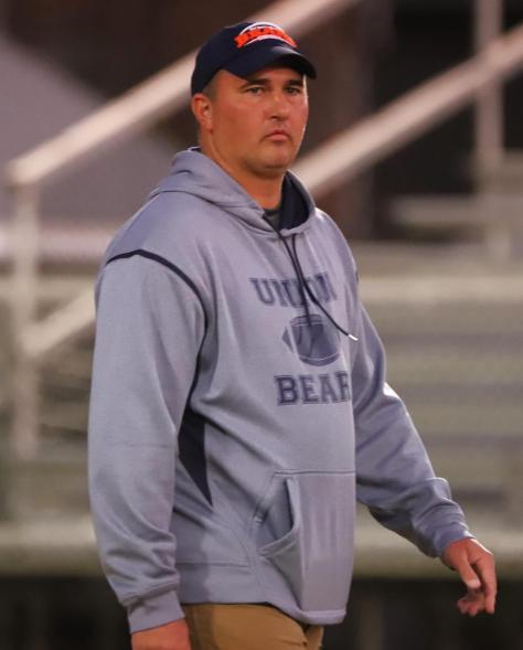 A reward is offered by the US for the apprehension of a missing Virginia football coach who is accused of child pornography.