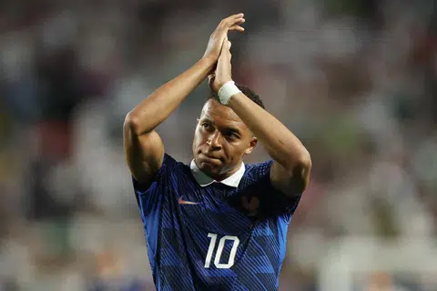 Mbappe double sends France into knockout rounds after lengthy weather delay